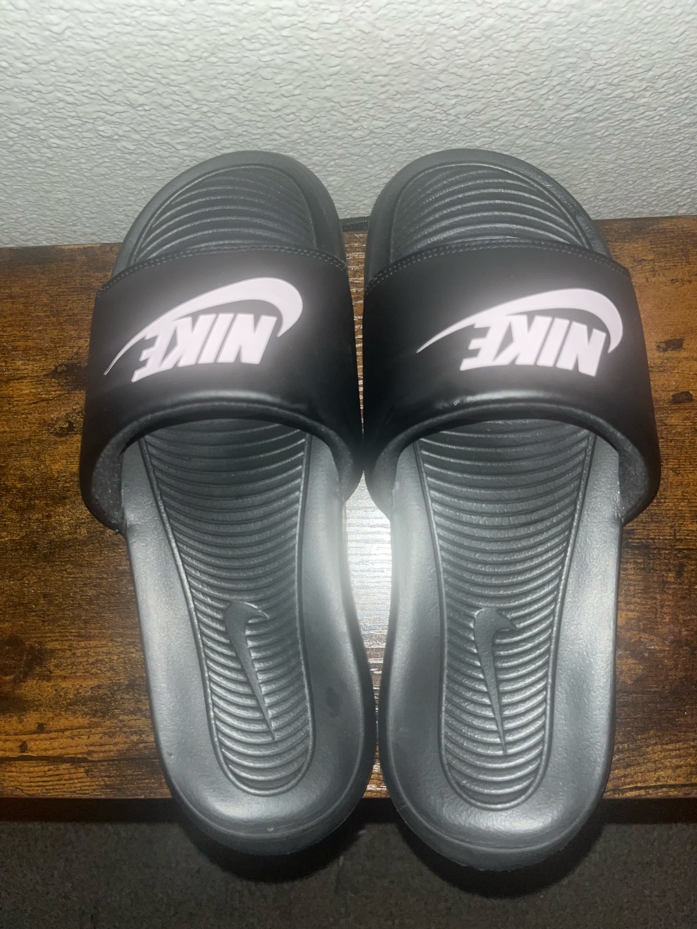 Nike women’s Black Slide Sandals with White Logo